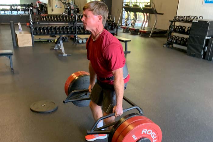 Get Expert Fitness Training from a Certified Personal Trainer at CD Fit Charleston with NJB Training. A client of NJB Training prepares to lift.